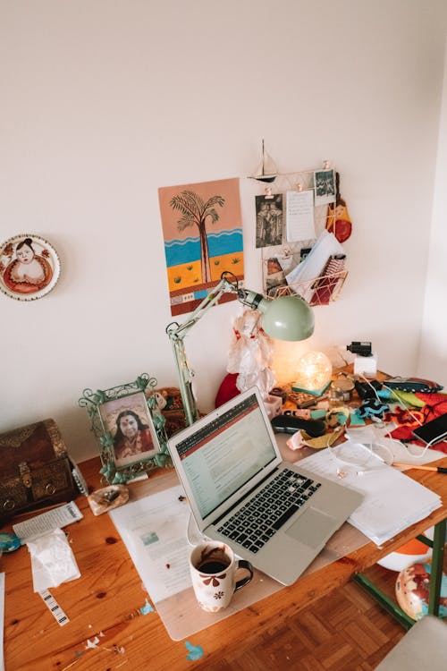 Laptop on Table Beside Mug