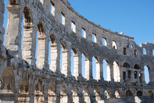 Free Majestic view of the ancient Roman amphitheater in Pula, Croatia under clear blue skies. Stock Photo