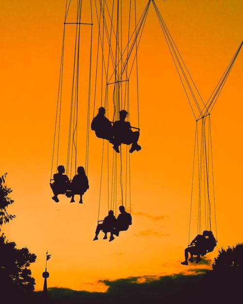 Vienna Swing Ride Happy Couple on Chain Swings · Free Stock Photo