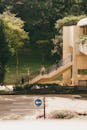 Urban Scene with Pedestrian Bridge and Lush Foliage