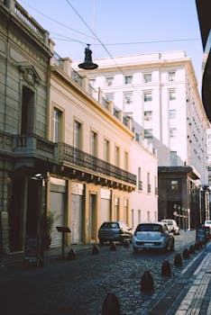 Sunlit street showcasing historic architecture in Buenos Aires, Argentina.