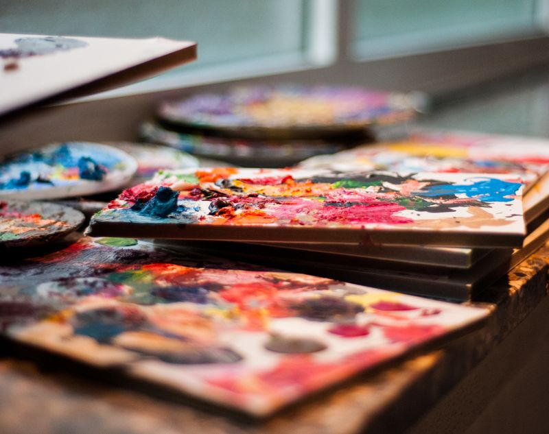 Vibrant artist paint palettes with colorful acrylics