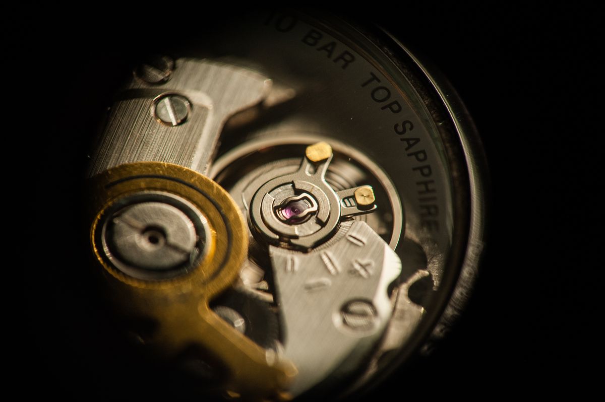 Macro detail of a mechanical watch movement and balance wheel — photo by Gunnar Hoffmann on Pexels