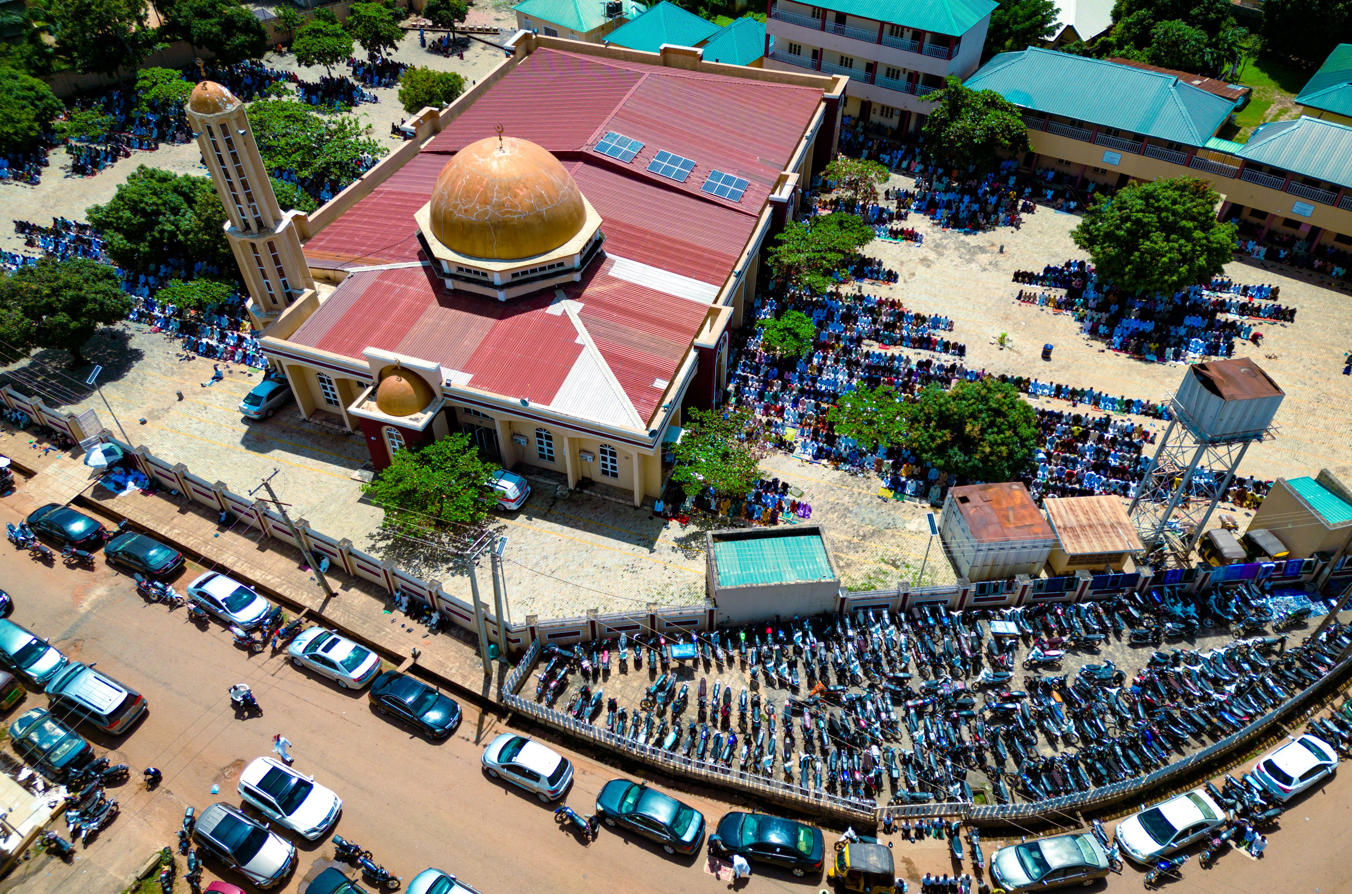 Aerial view of Christ Embassy Loveworld Arena in Ho, Volta Region, with crowds of worshippers outside