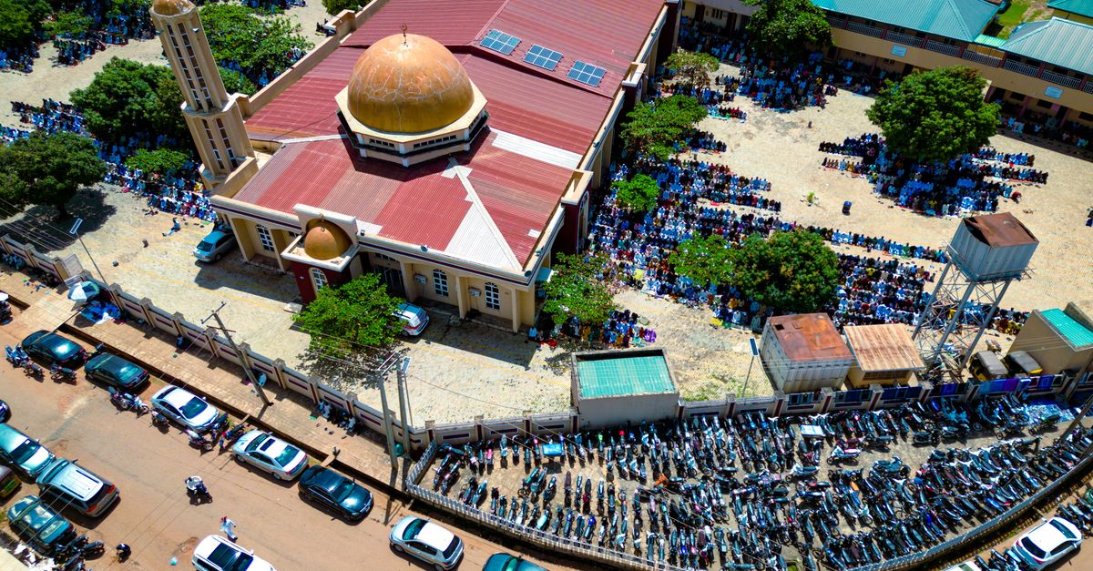 Aerial view of Christ Embassy Loveworld Arena in Ho, Volta Region, with crowds of worshippers outside