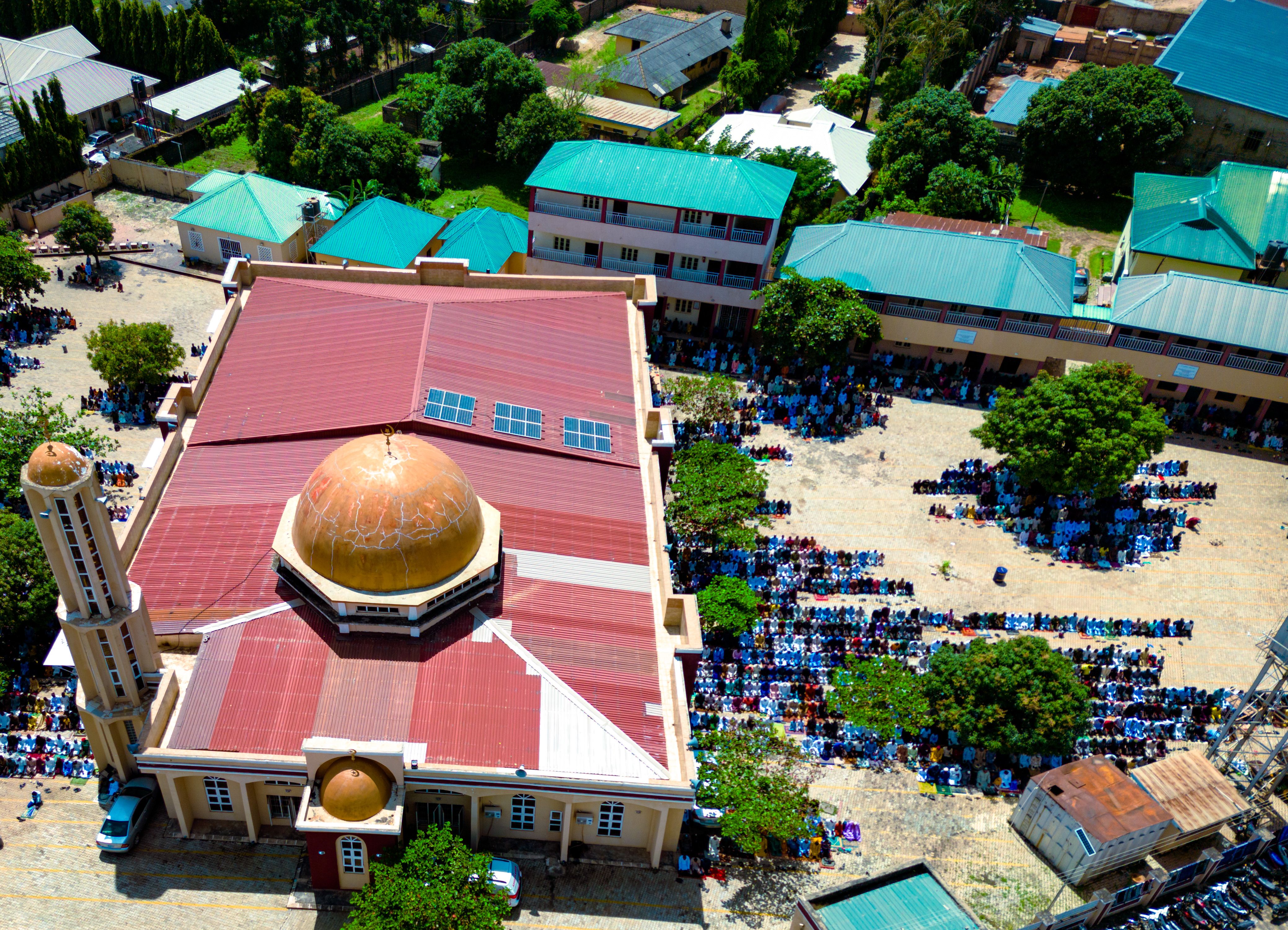 Aerial view of a mosque and congregation during prayer in Kaduna, Nigeria.