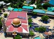 Aerial view of a mosque and congregation during prayer in Kaduna, Nigeria.