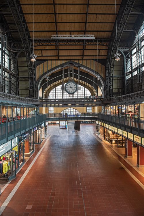 Free A wide-angle shot of the spacious interior of Hamburg Central Station, showcasing its grand architecture. Stock Photo