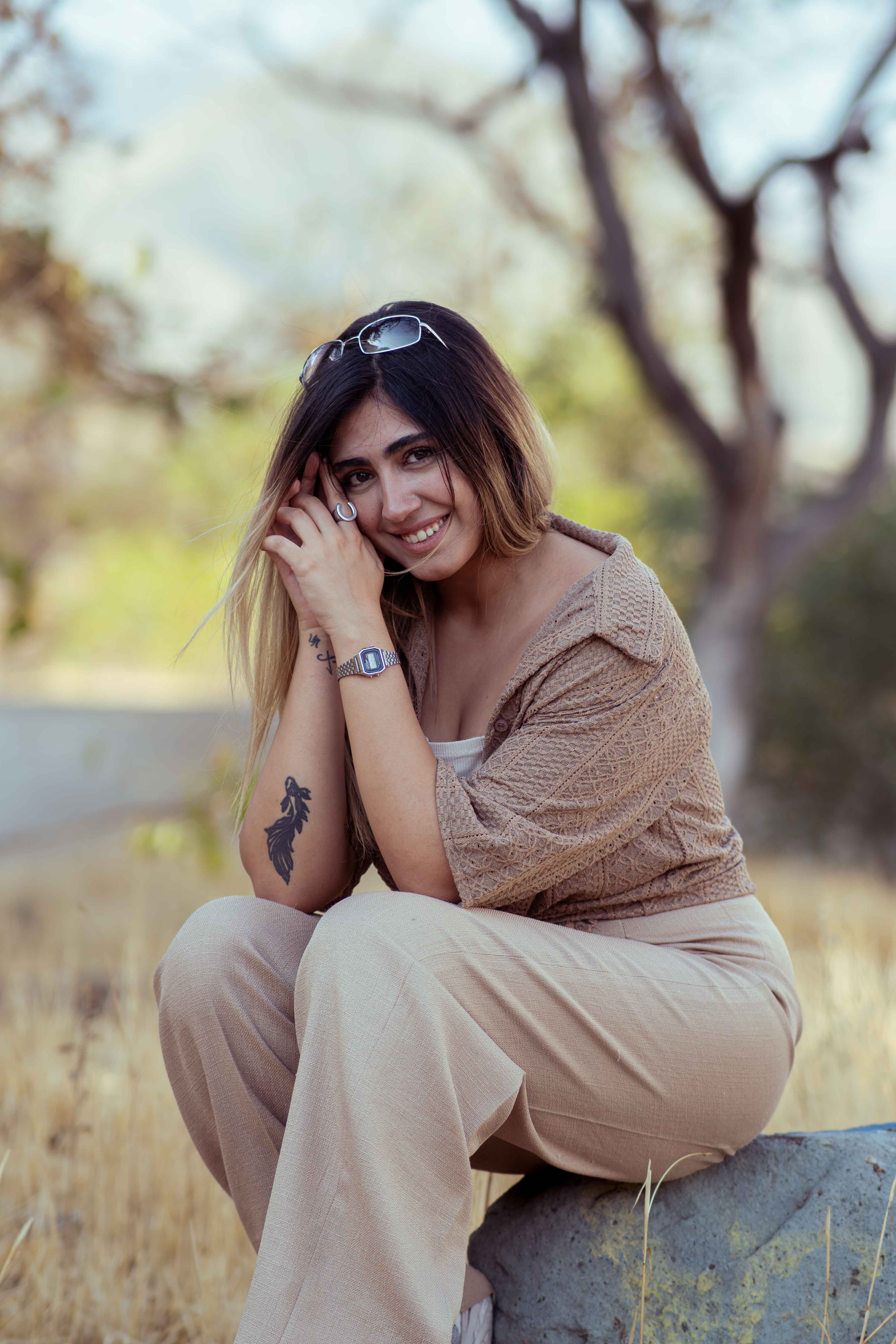 Smiling Woman Outdoors in Tehran Park Setting · Free Stock Photo