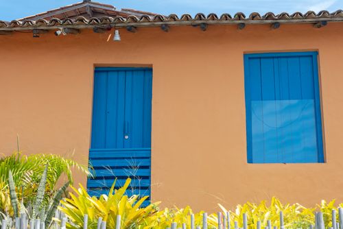 Free Colorful facade with blue door and window in Arraial d'Ajuda, Bahia, Brazil. Stock Photo