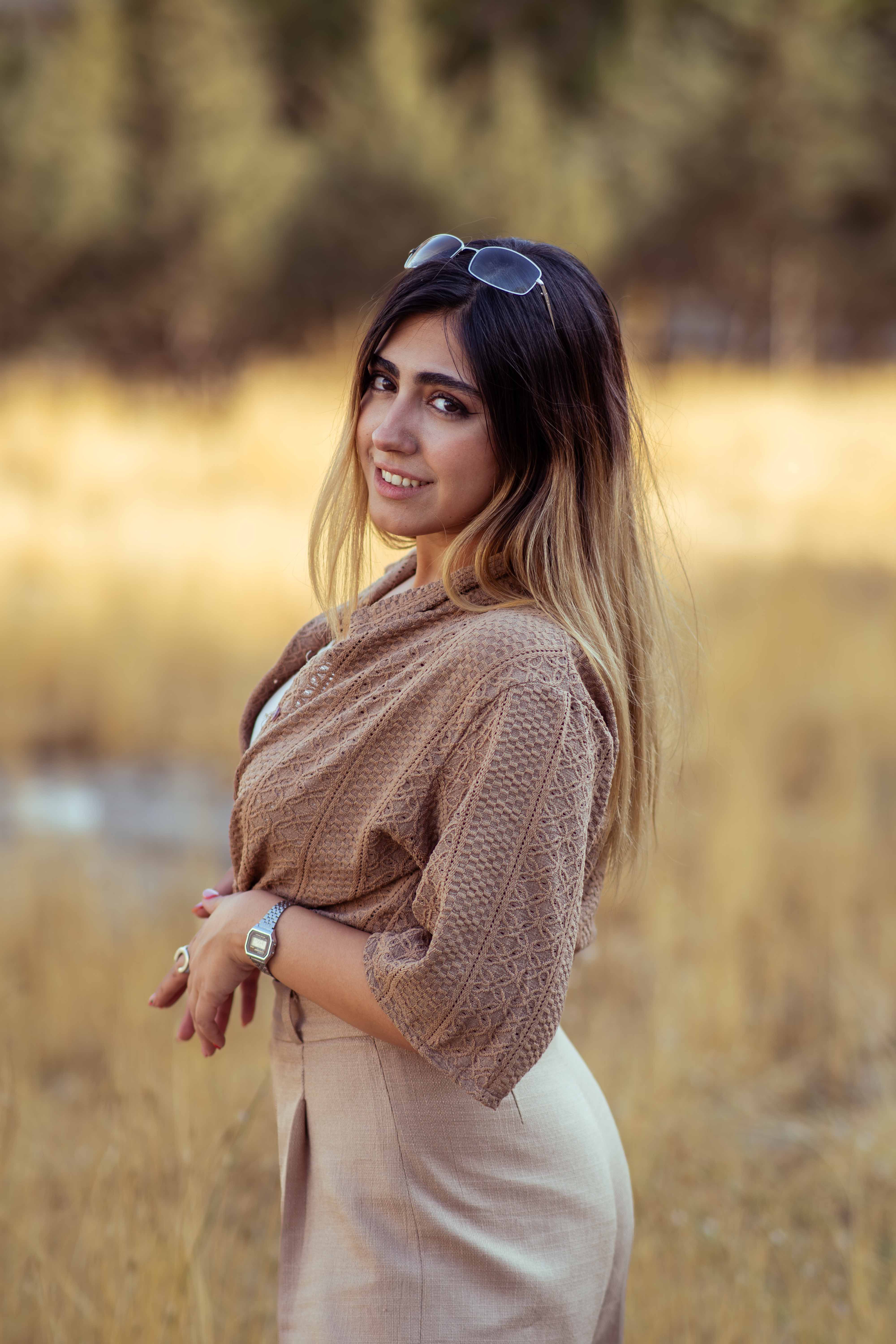 Elegant portrait of a woman in Tehran, showcasing natural beauty and style in an outdoor setting.
