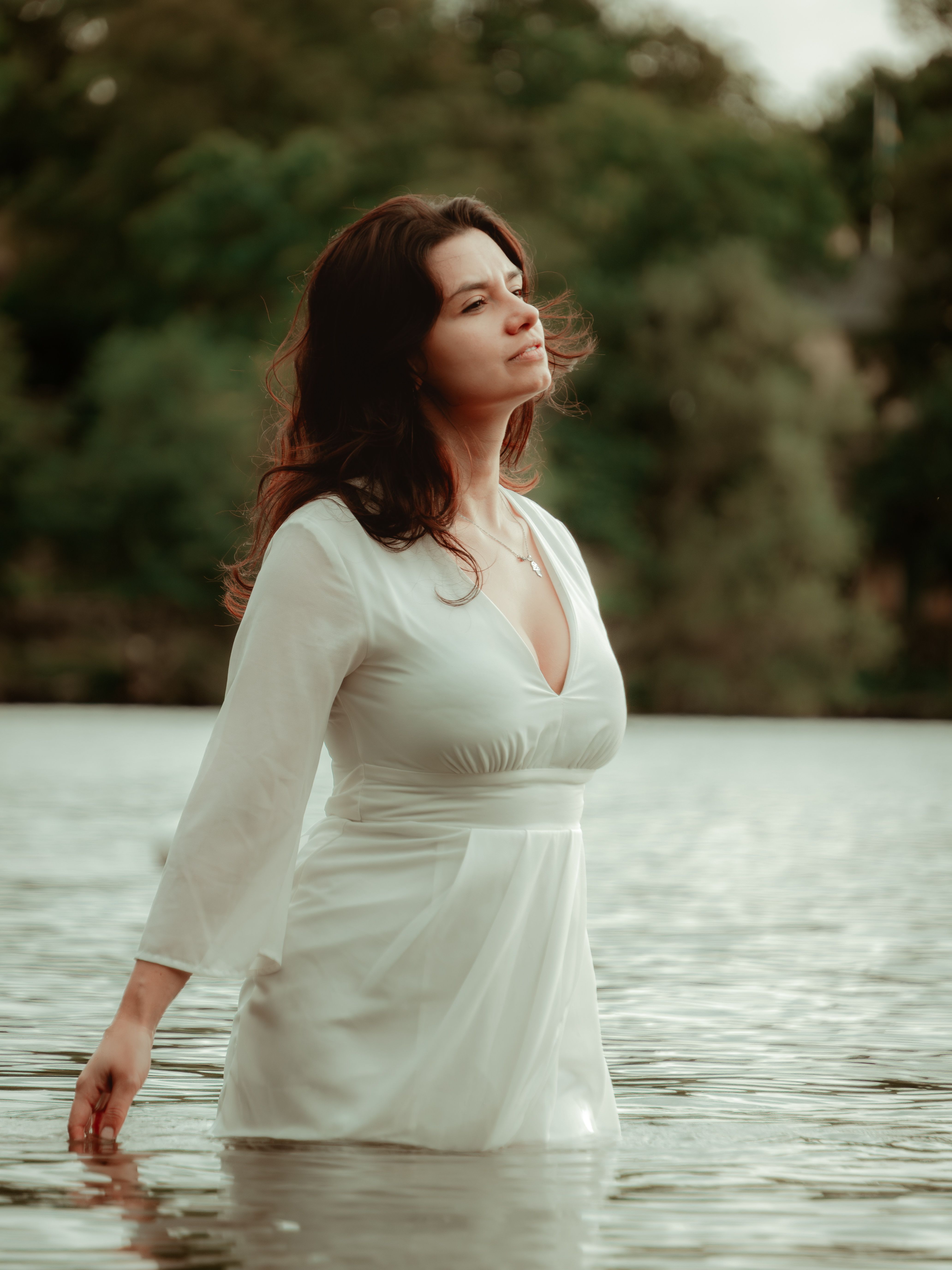 A Woman Wearing White Dress Standing on the Water · Free Stock Photo