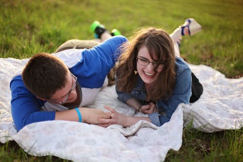 Free Two Person Laying on White Mat Stock Photo
