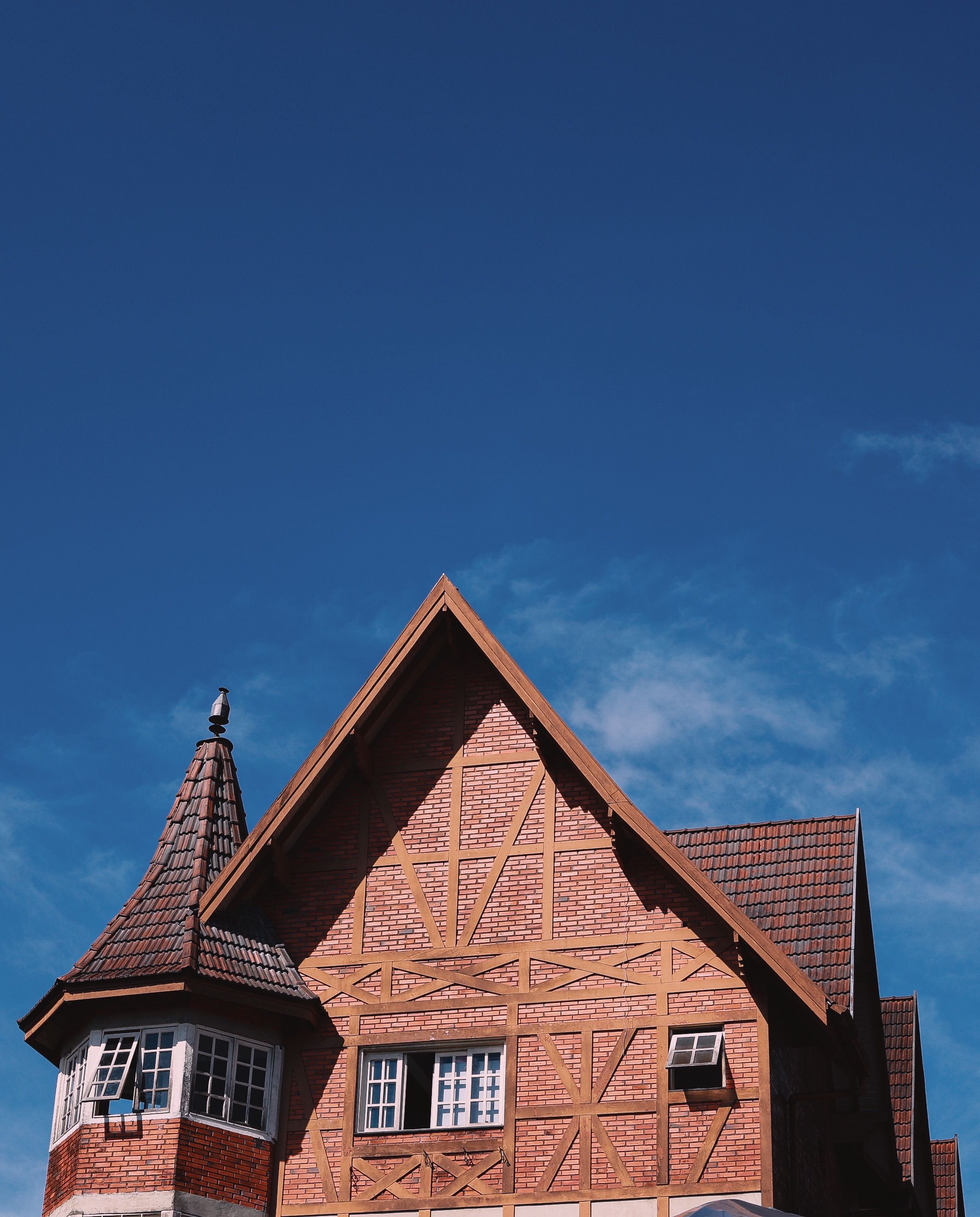 Gothic Style House Under Clear Blue Sky · Free Stock Photo