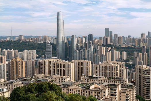 A dynamic cityscape showcasing tall skyscrapers under a clear sky, highlighting urban architecture.