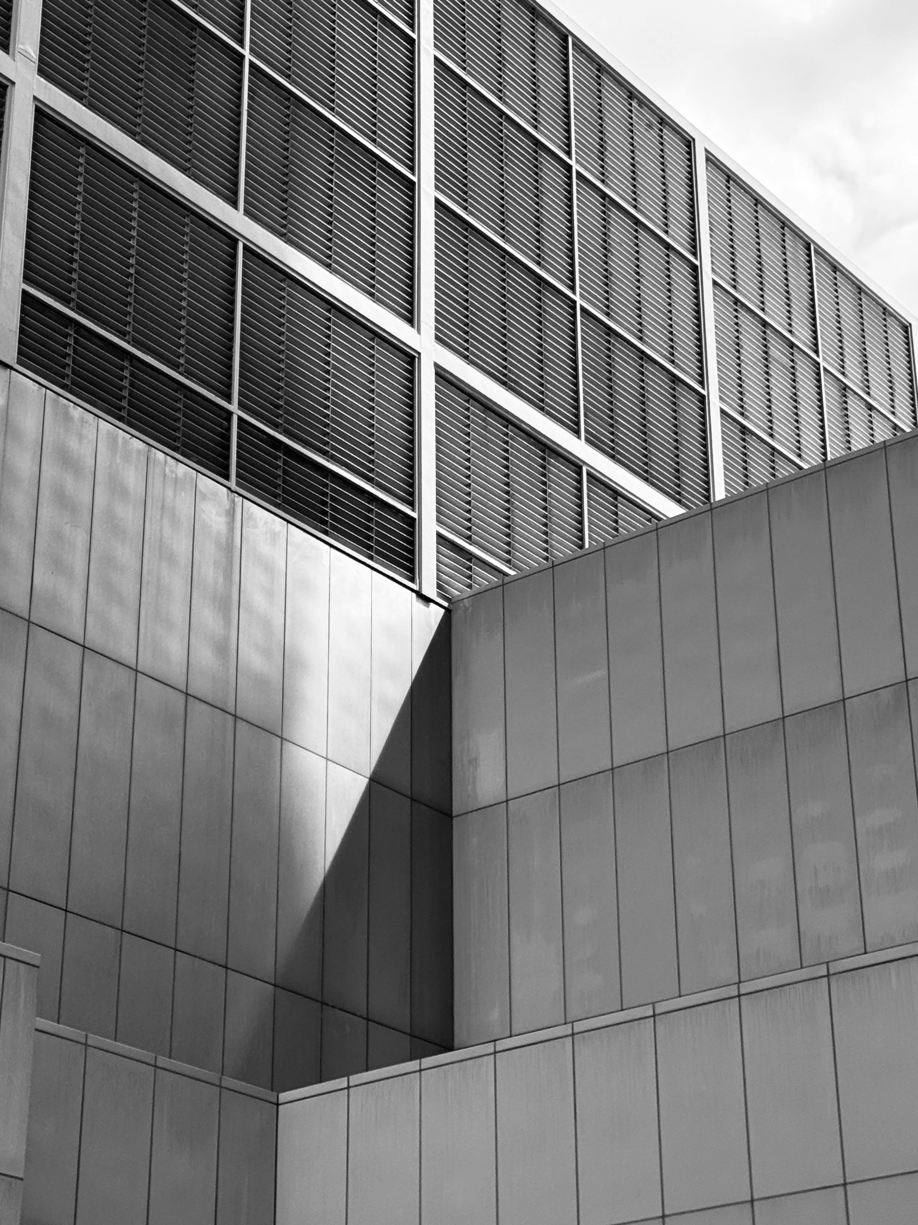 Sleek and modern minimalist architecture captured in monochrome, showcasing geometric shapes and lines.