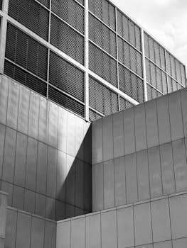 Sleek and modern minimalist architecture captured in monochrome, showcasing geometric shapes and lines.