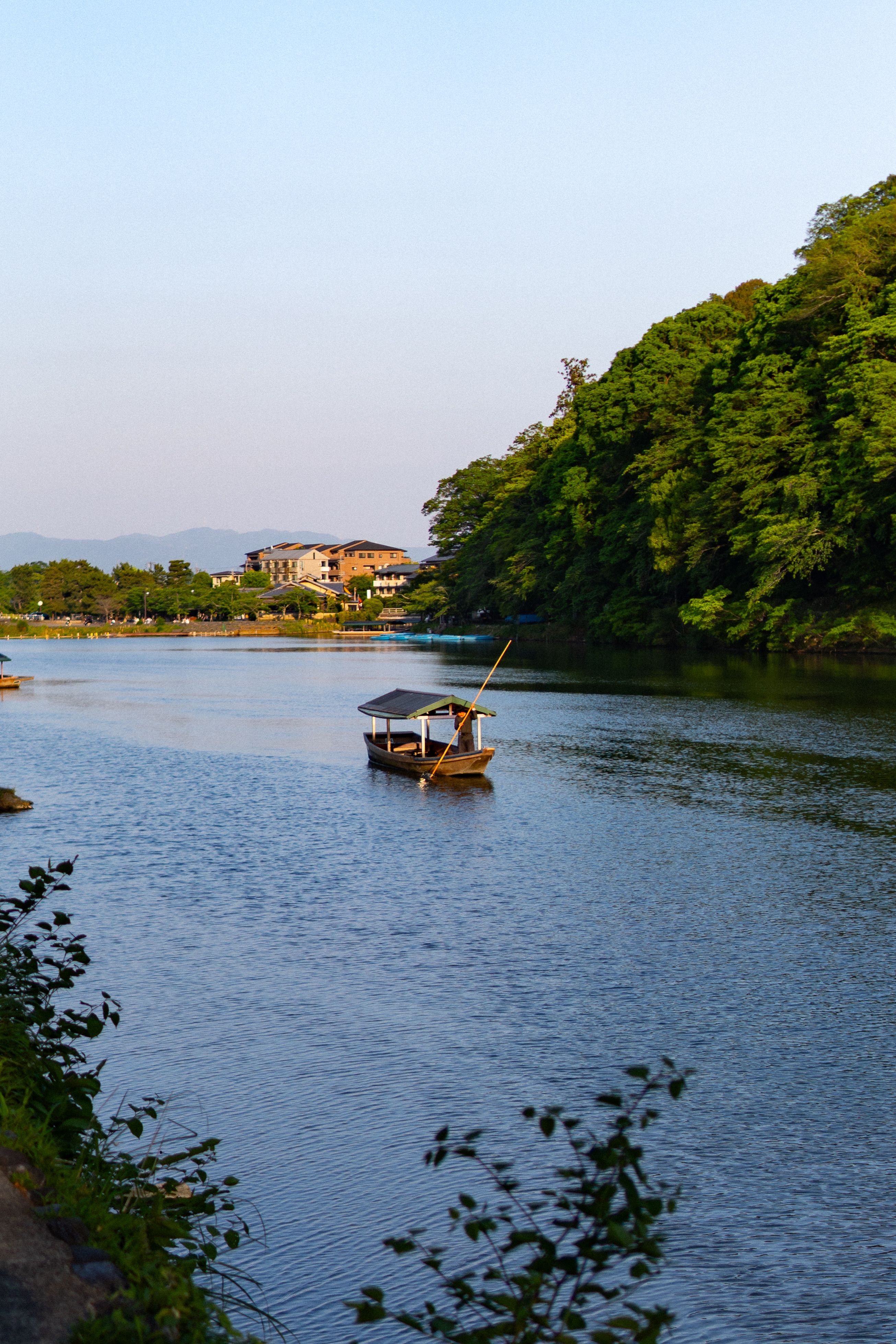 Traditional Boat on Peaceful River in Japan · Free Stock Photo