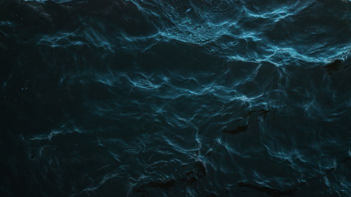 Ocean wave texture photographed by Kris Møklebust on Pexels