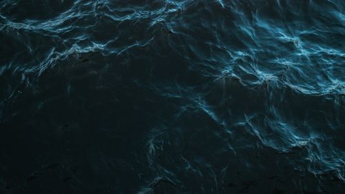 Free Artistic depiction of dark ocean waves with a moody and abstract vibe. Stock Photo