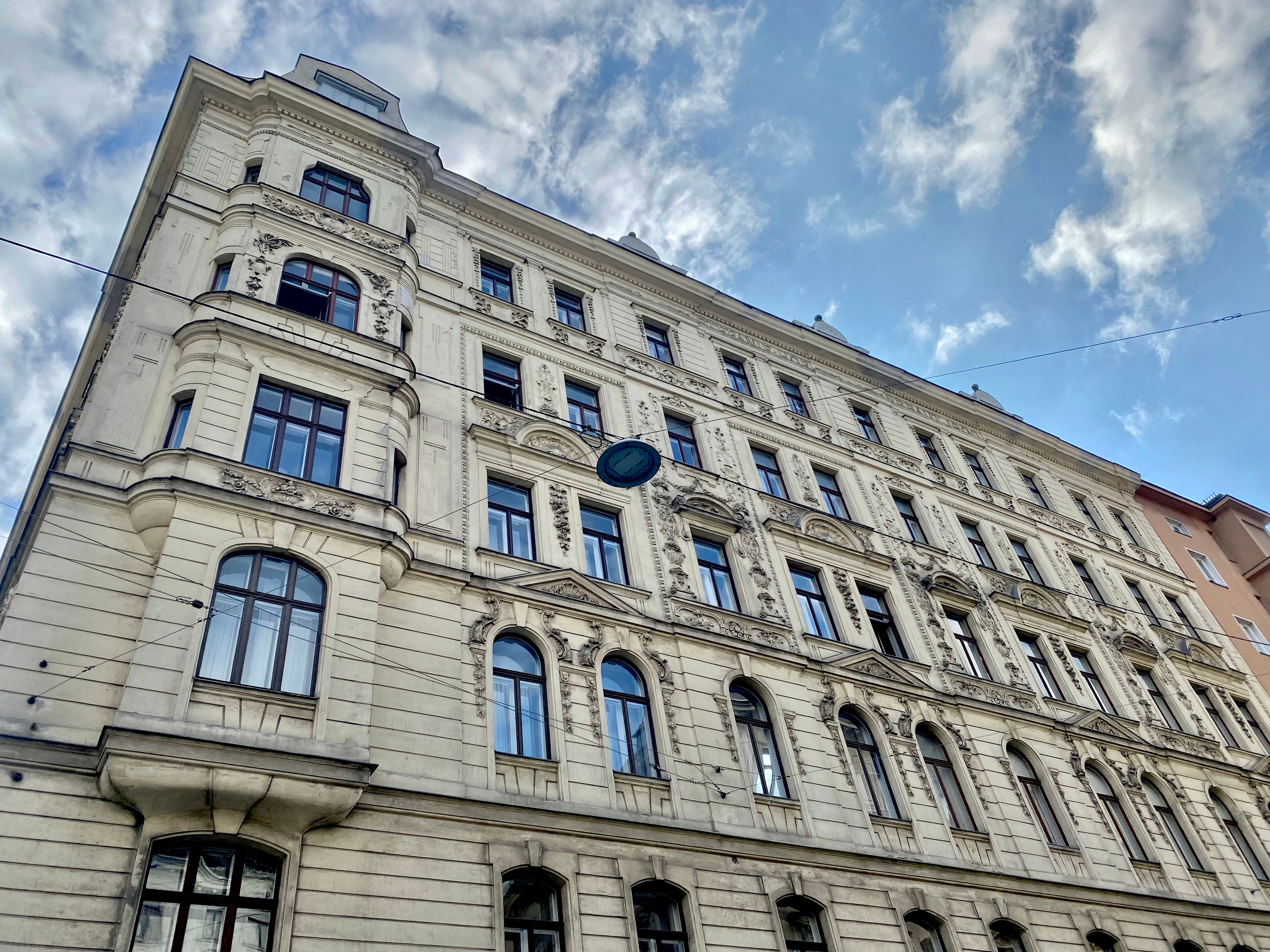 Historic Building Facade Under Blue Sky · Free Stock Photo