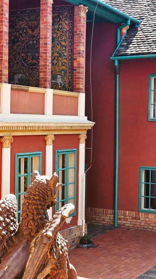 Free Stunning architectural detail in a vibrant courtyard in Pécs, Hungary, showcasing classical design elements. Stock Photo