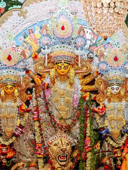 Colorful and ornate Durga Puja idol capturing traditional craftsmanship and cultural celebration in Kolkata.