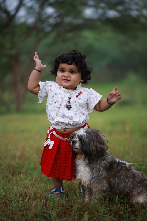 Free Adorable child with dog enjoying a day outdoors in Loveland, Ohio. Stock Photo