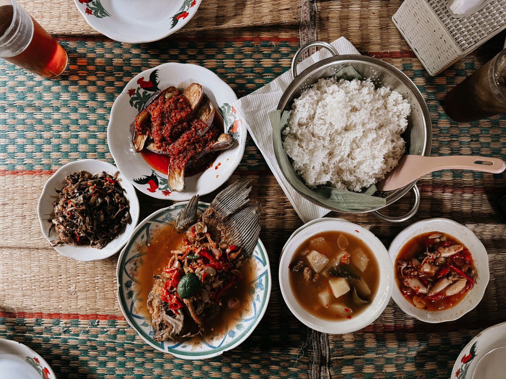 A traditional Indonesian meal arrangement with rice and assorted dishes in Jakarta.