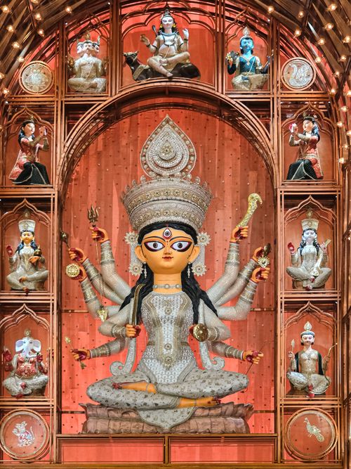 Free A beautifully detailed Durga idol surrounded by smaller deities during Durga Puja festival in Kolkata. Stock Photo