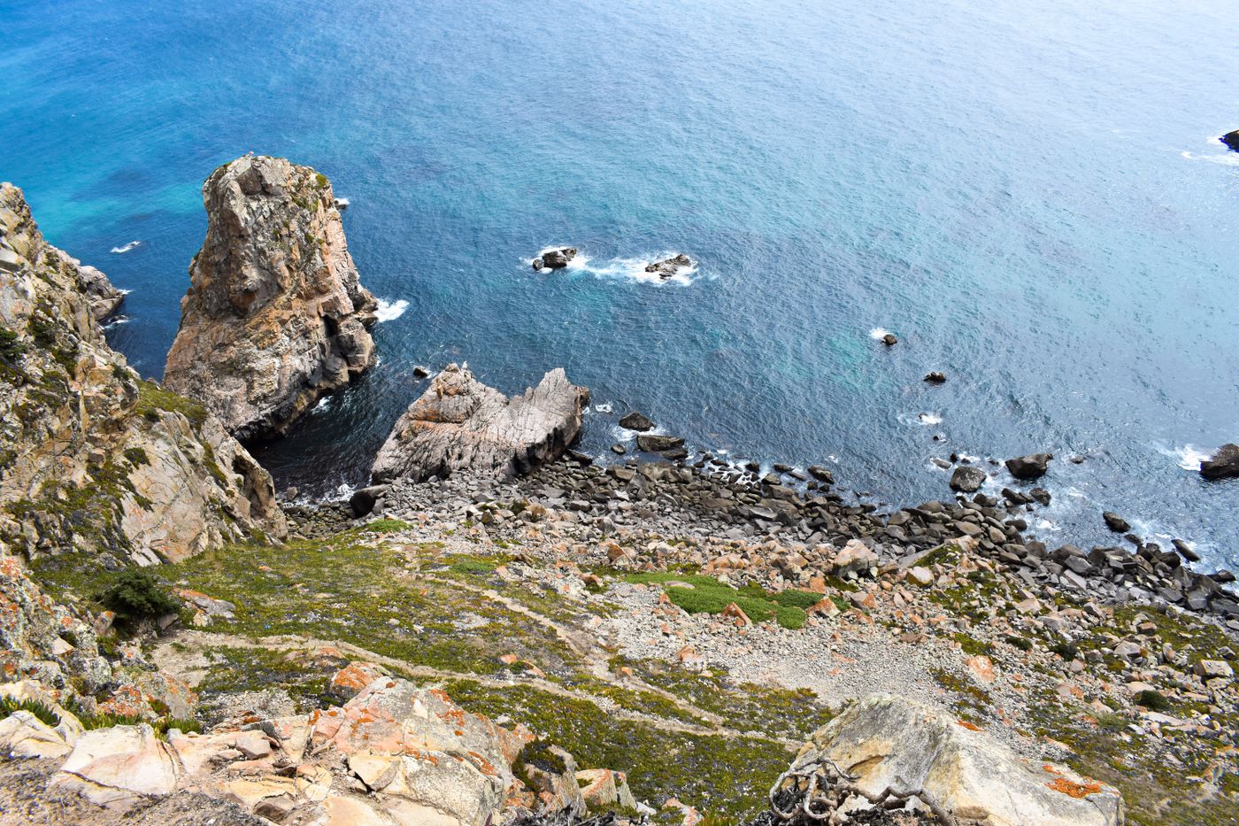 Rocky Atlantic cliffs above deep blue sea on the Portuguese coast