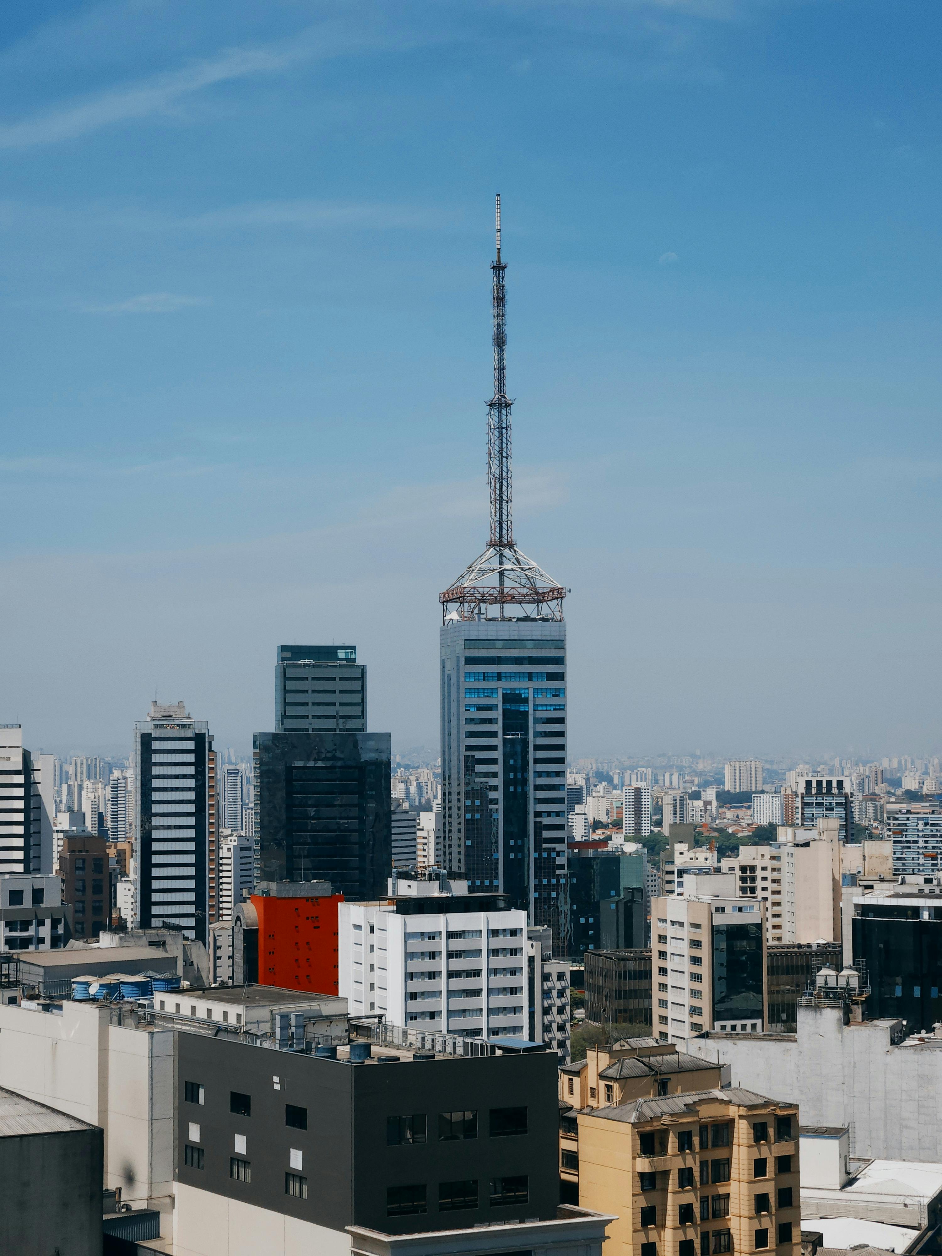 Brazilian apartment buildings under open sky, reinforcing the article's focus on choosing livable neighborhoods rather than just tourist zones.