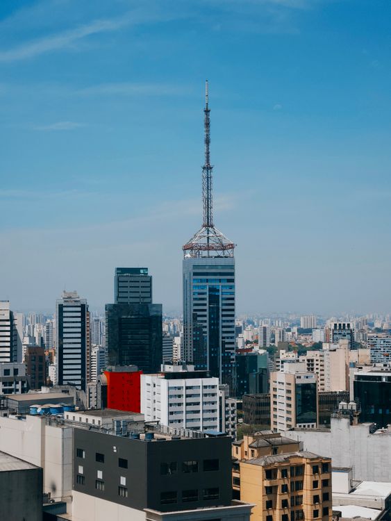 Brazilian apartment buildings under open sky, reinforcing the article's focus on choosing livable neighborhoods rather than just tourist zones.