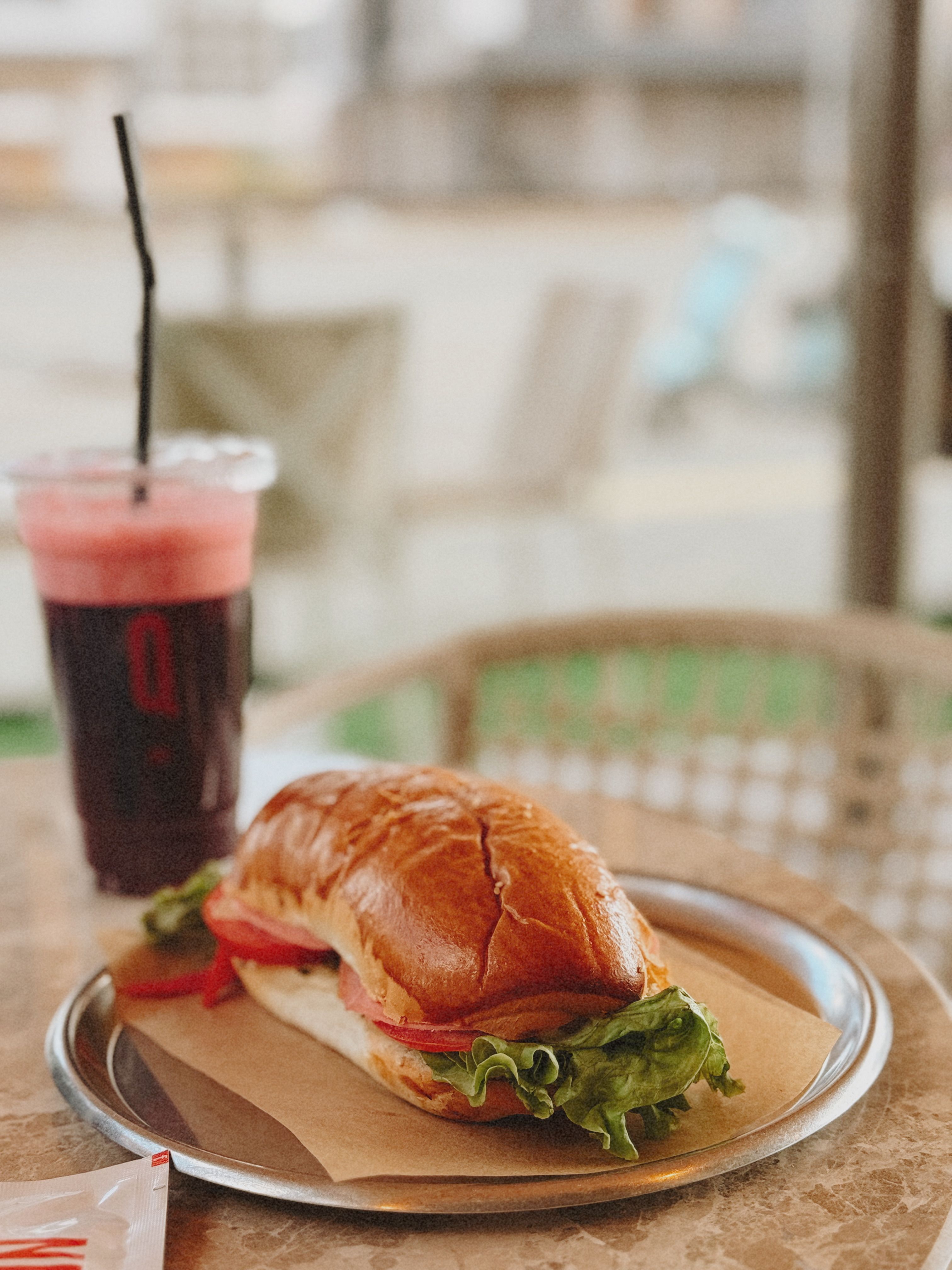 Delicious Sandwich and Juice on Cafe Table · Free Stock Photo — free download