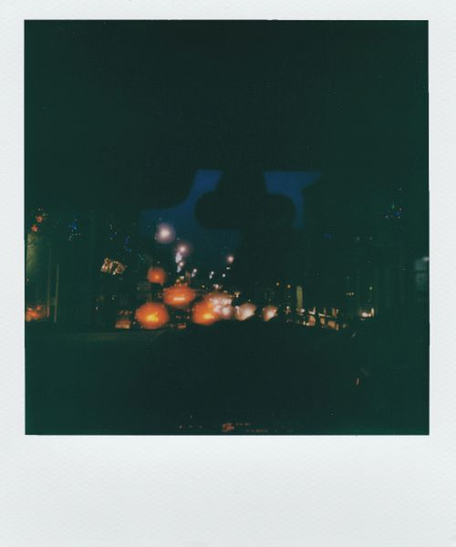 Free A captivating instant film photograph of blurred street lights at night. Stock Photo