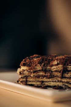 Rich chocolate layered dessert on a plate, perfect for indulgence.