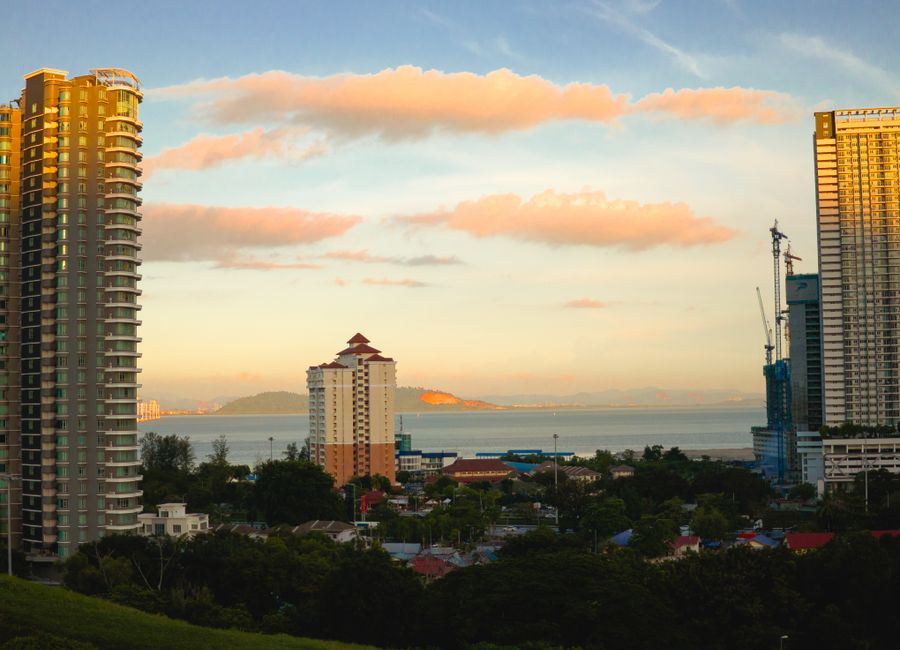 Golden hour cityscape view of Gelugor, Pulau Pinang, Malaysia with coastal background.