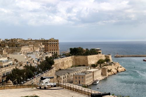Free Explore the stunning waterfront and historic architecture of Valletta, Malta, captured in a vibrant daytime shot. Stock Photo
