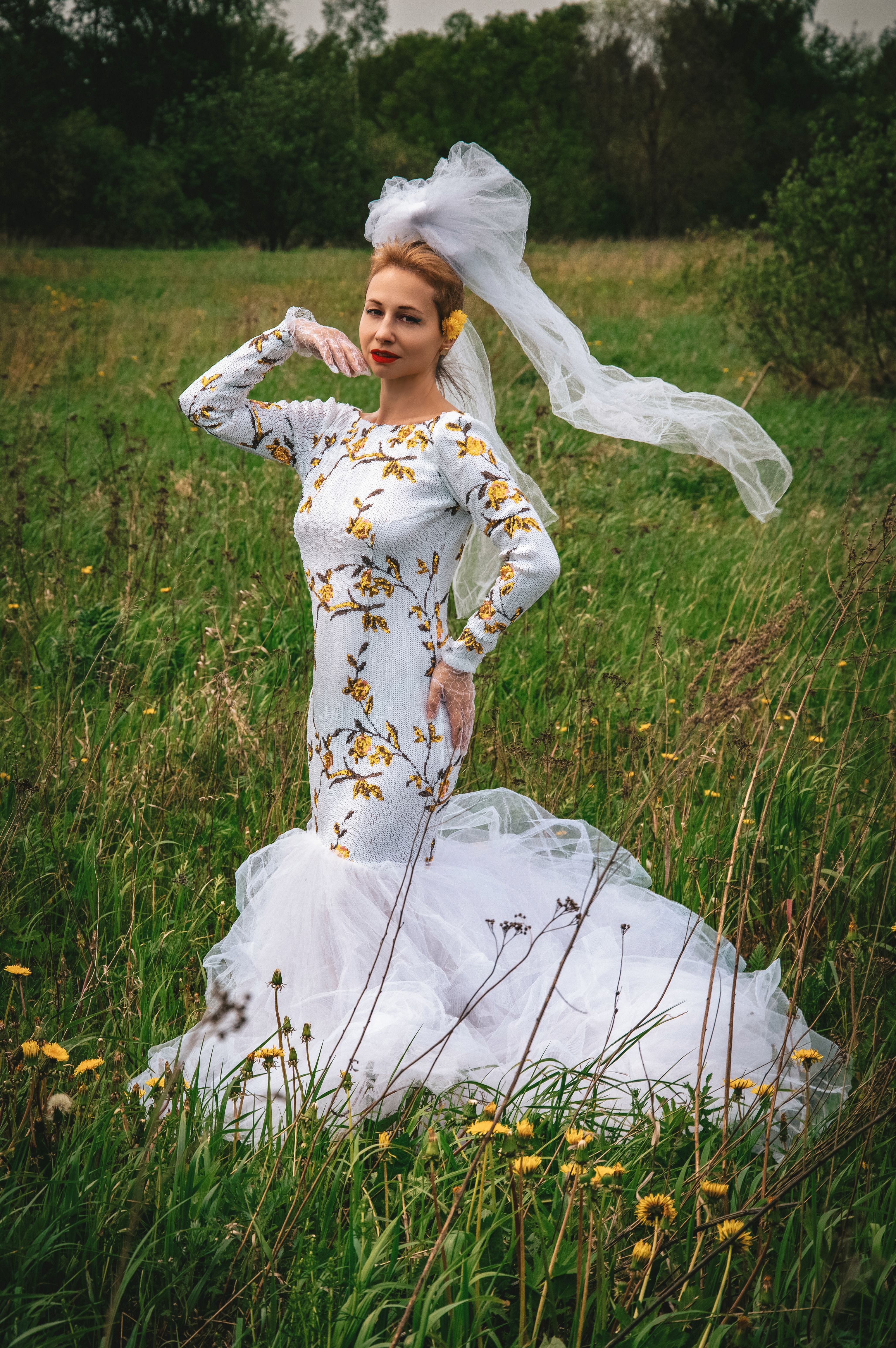 Bride in Floral Wedding Dress Posing Outdoors