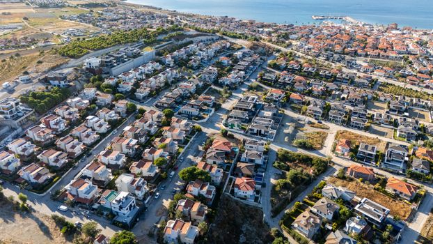 A stunning aerial view of a coastal suburb, showcasing homes and a marina. Ideal for real estate and travel themes.