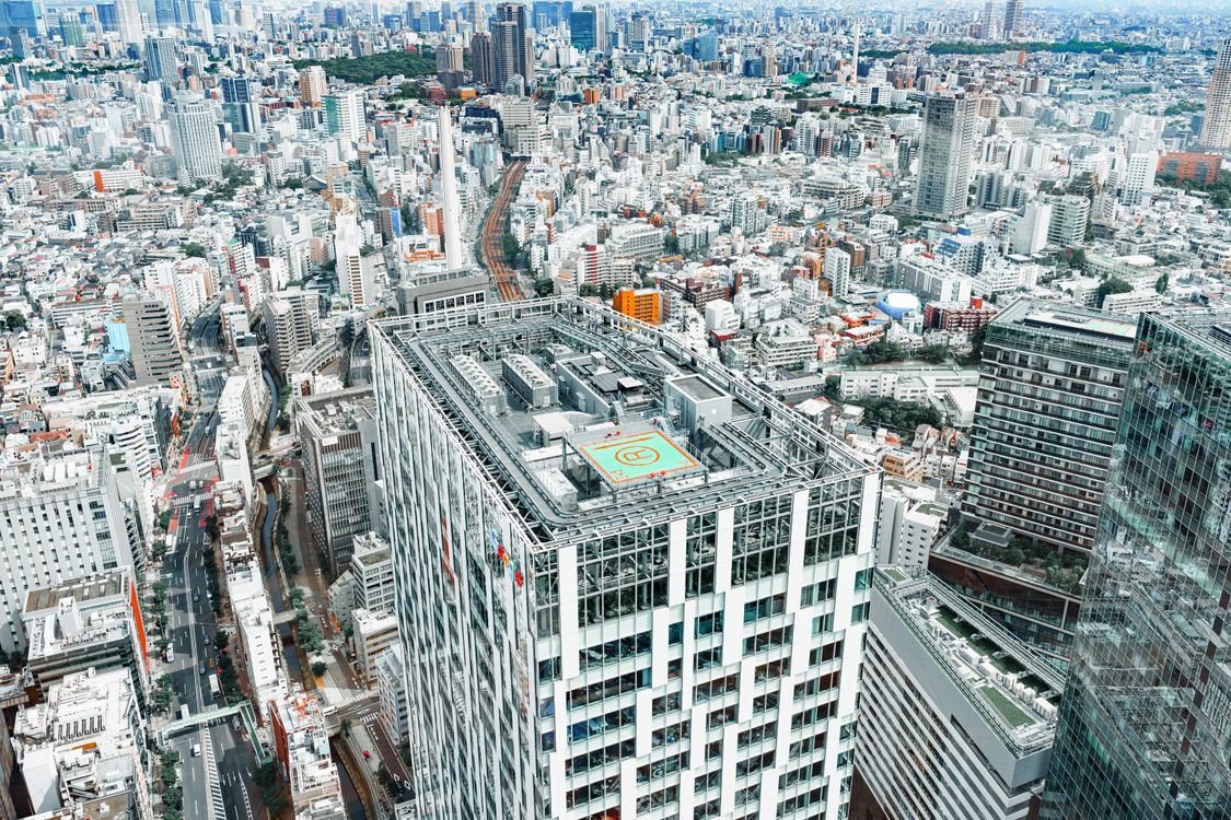 Aerial view of Tokyo city skyline with helipad on a modern building