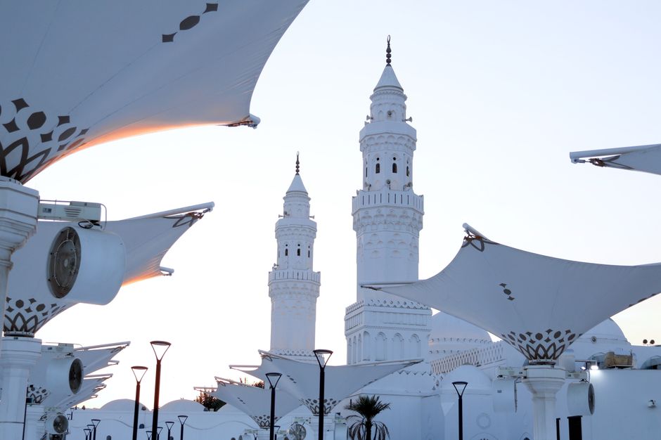 Modern architectural canopies and mosque towers in Madinah, showcasing Islamic design.