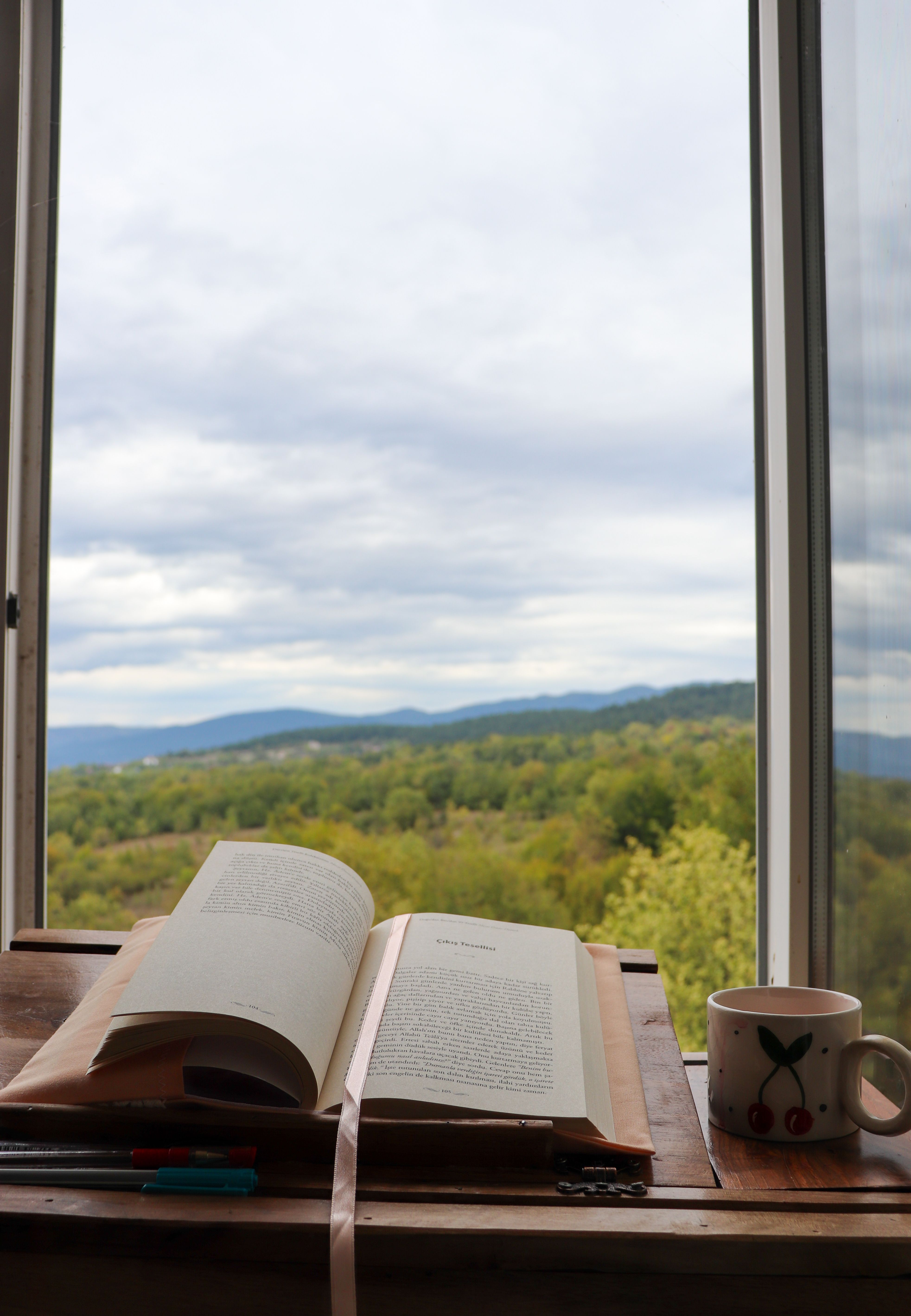 Book and coffee by a window, by Gizem Gökce on Pexels