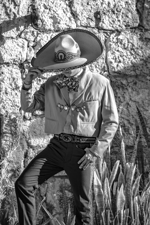 Free Black and white photo of a person wearing a traditional Mexican charro outfit, highlighting folkloric fashion. Stock Photo