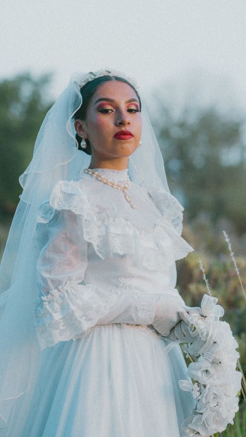 Free Elegant portrait of a woman in traditional white Mexican folk attire, showcasing cultural heritage. Stock Photo