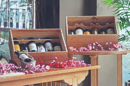 Free stock photo of alcohol bottles, exhibition, flowers Stock Photo