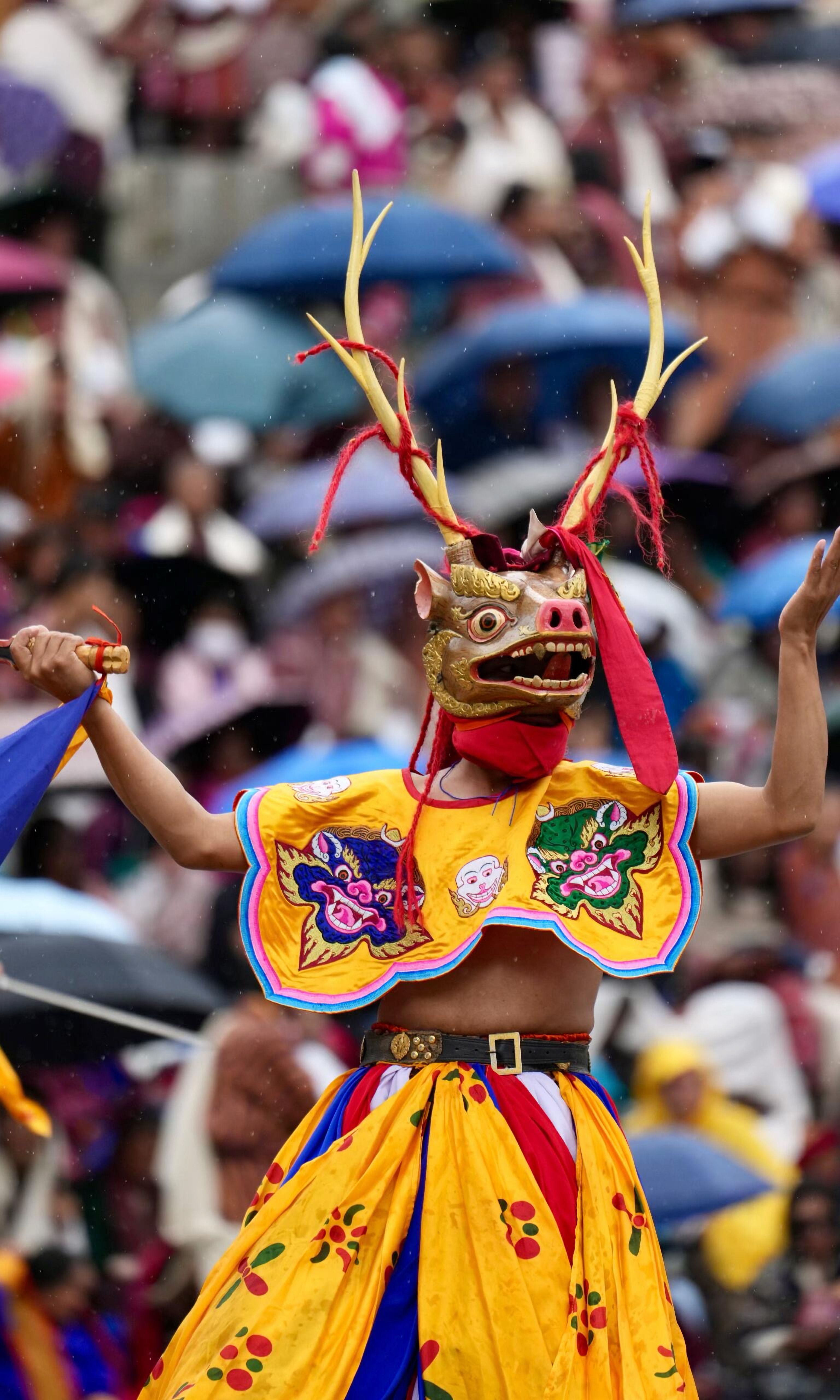 Colorful traditional dance performance at a lively cultural festival.