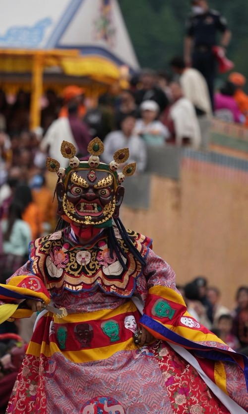 Free Colorful traditional masked dance at Bhutanese festival with vibrant costumes. Stock Photo