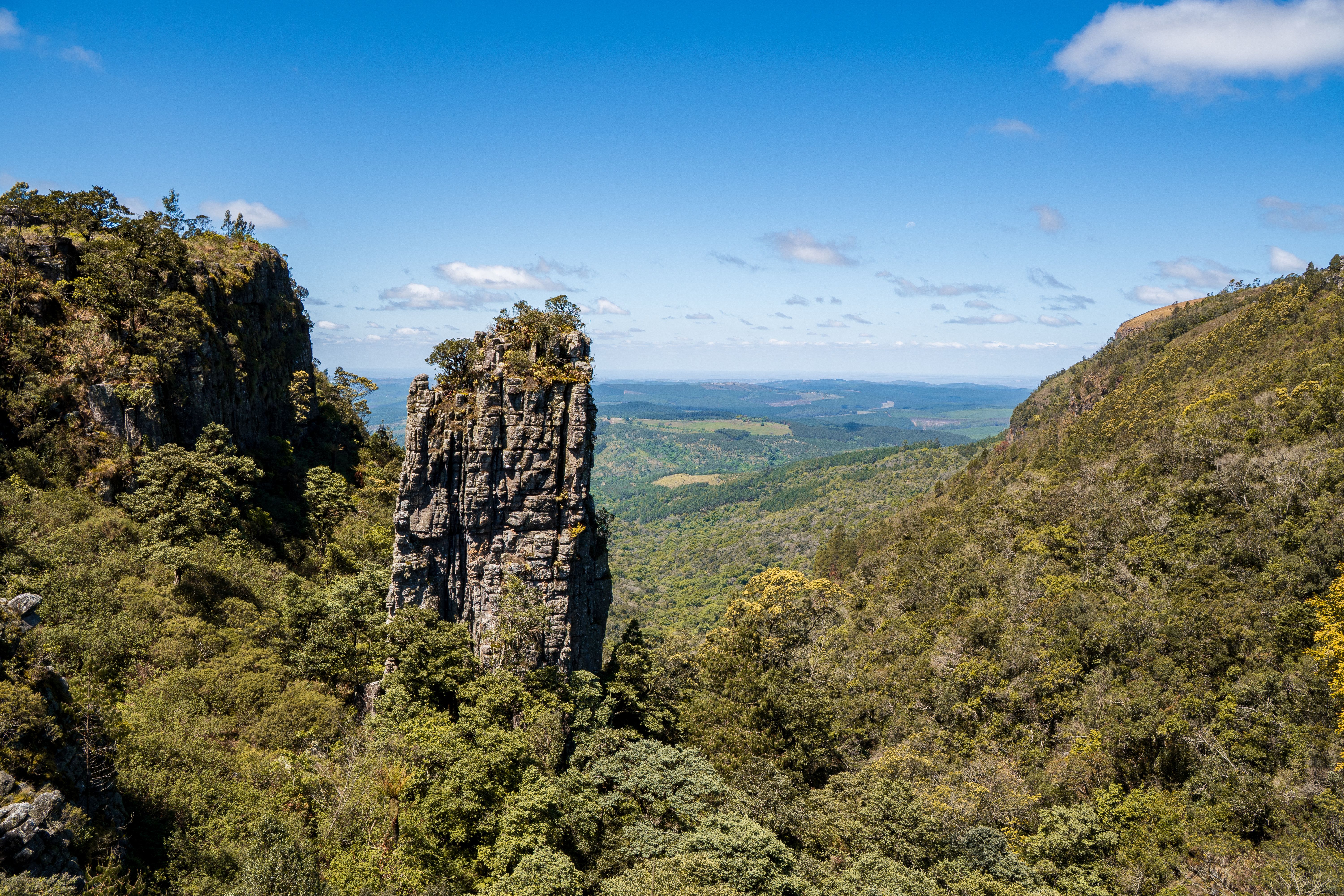 Dramatic mountain peak in lush green valley, Zimbabwe