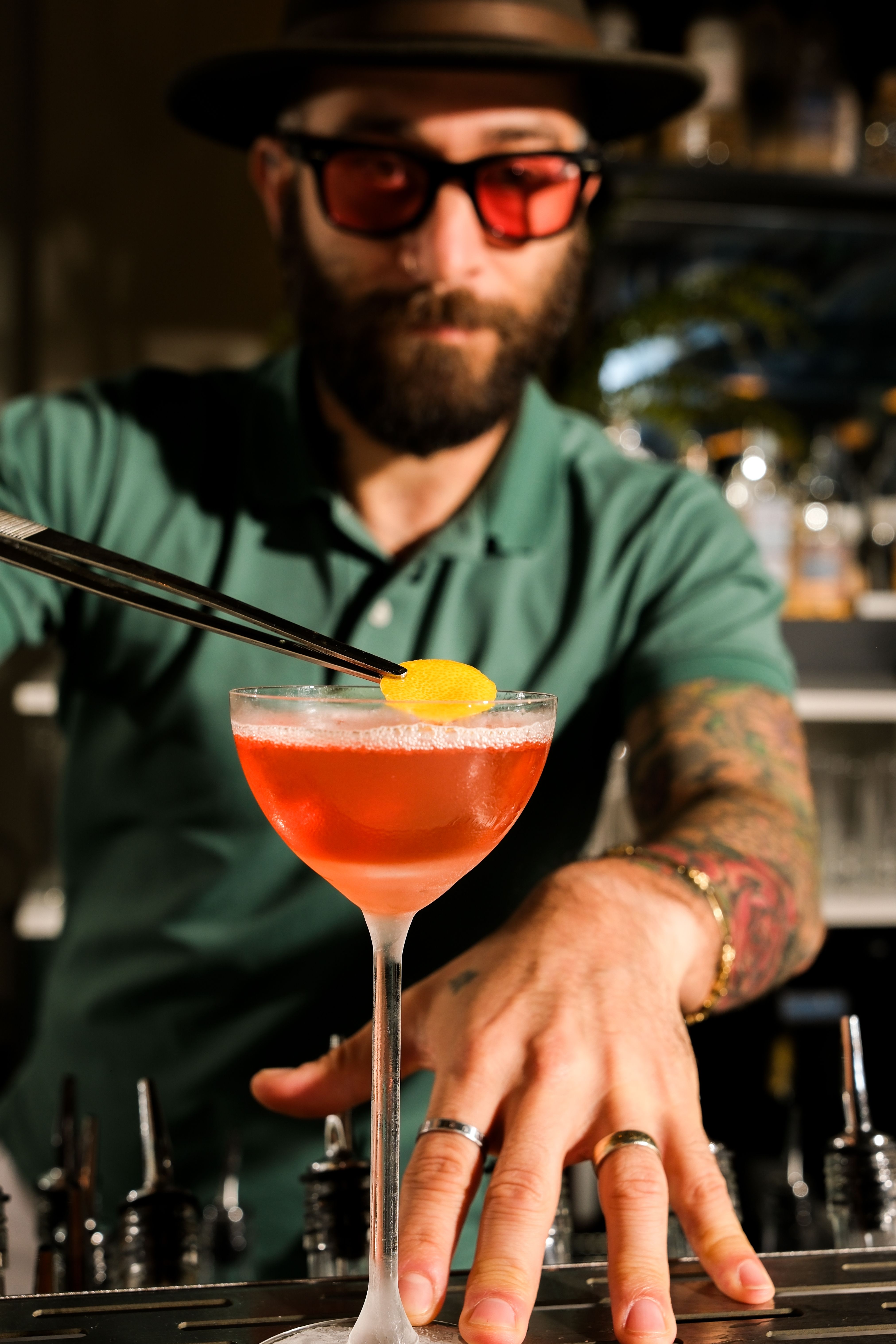 Bartender preparing a craft cocktail for a group celebration